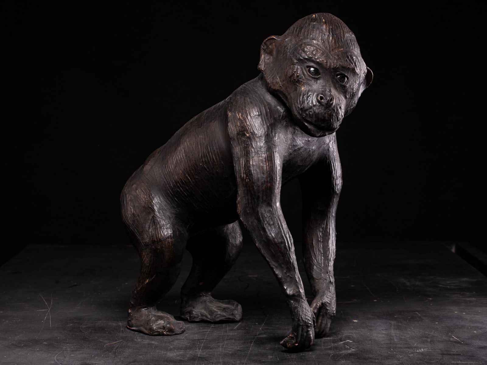 Leather walking Monkey Statue with Glass eyes, Unknown year