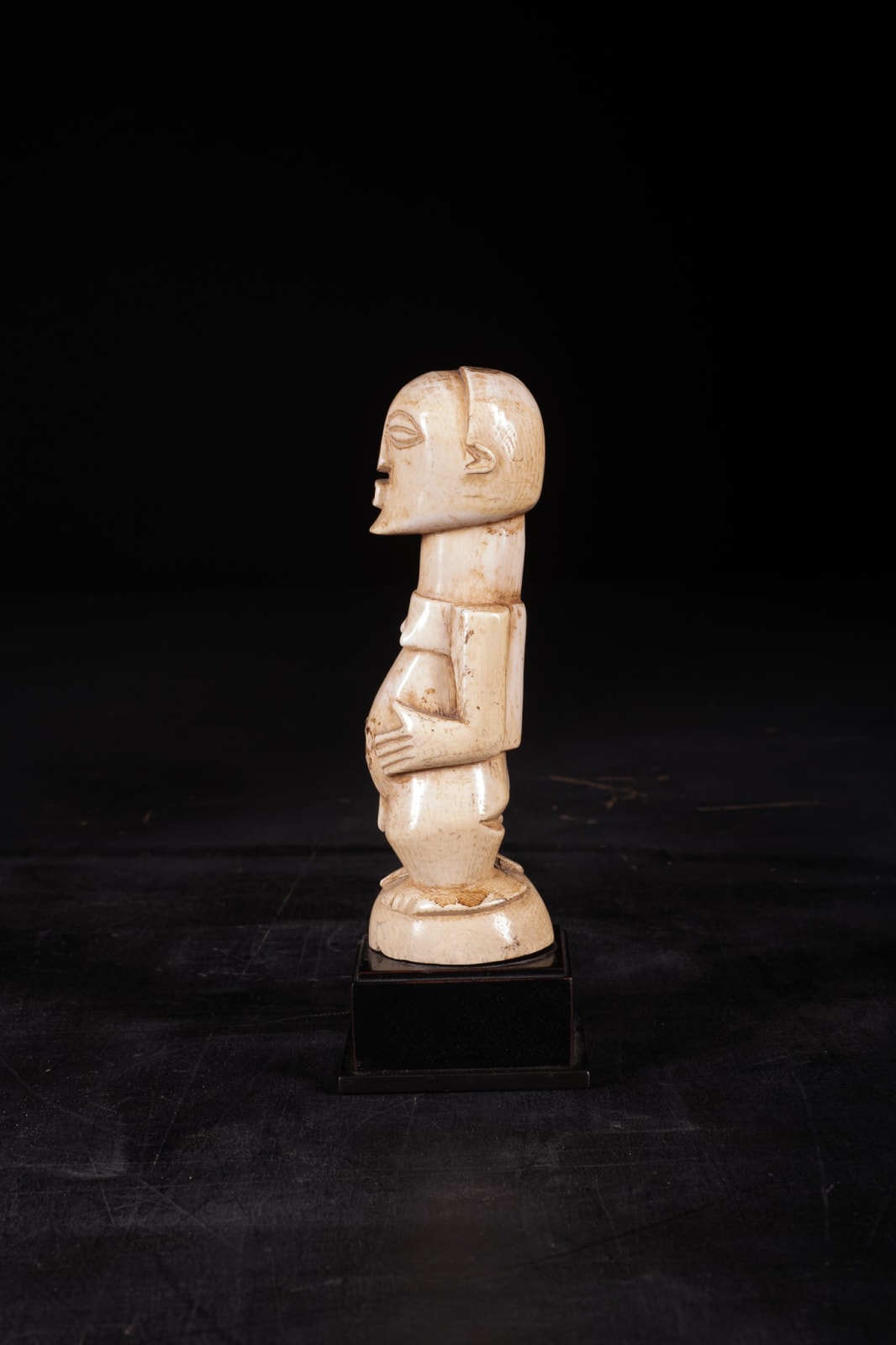 A fine and rare Songhe Ivory Male Nkishi with leftover of medecine.Songhe People,DRC., first half 20th C