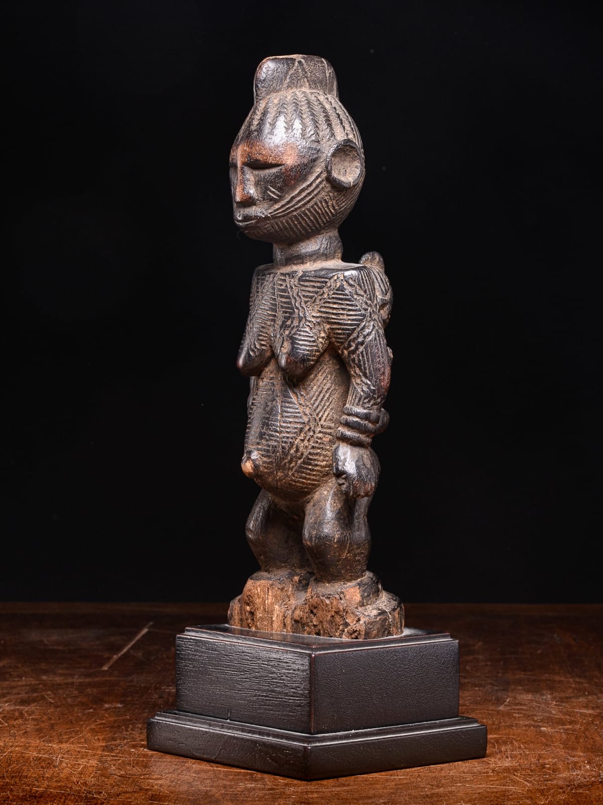 Igala scarified Maternity with infant on her back, Nigeria, 1st half 20th Century