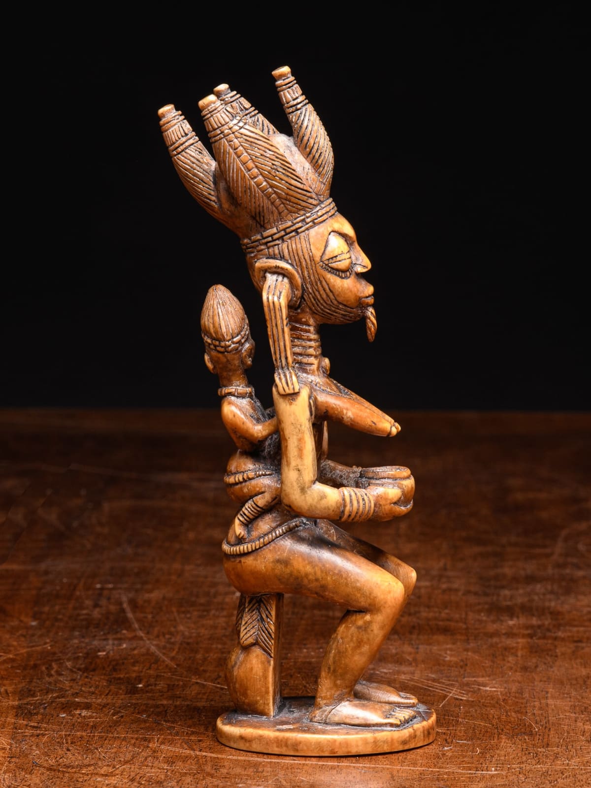 Yoruba Ivory sitting Maternity Altar Statue with royal attributes.Yoruba People, Nigeria., 20th Century