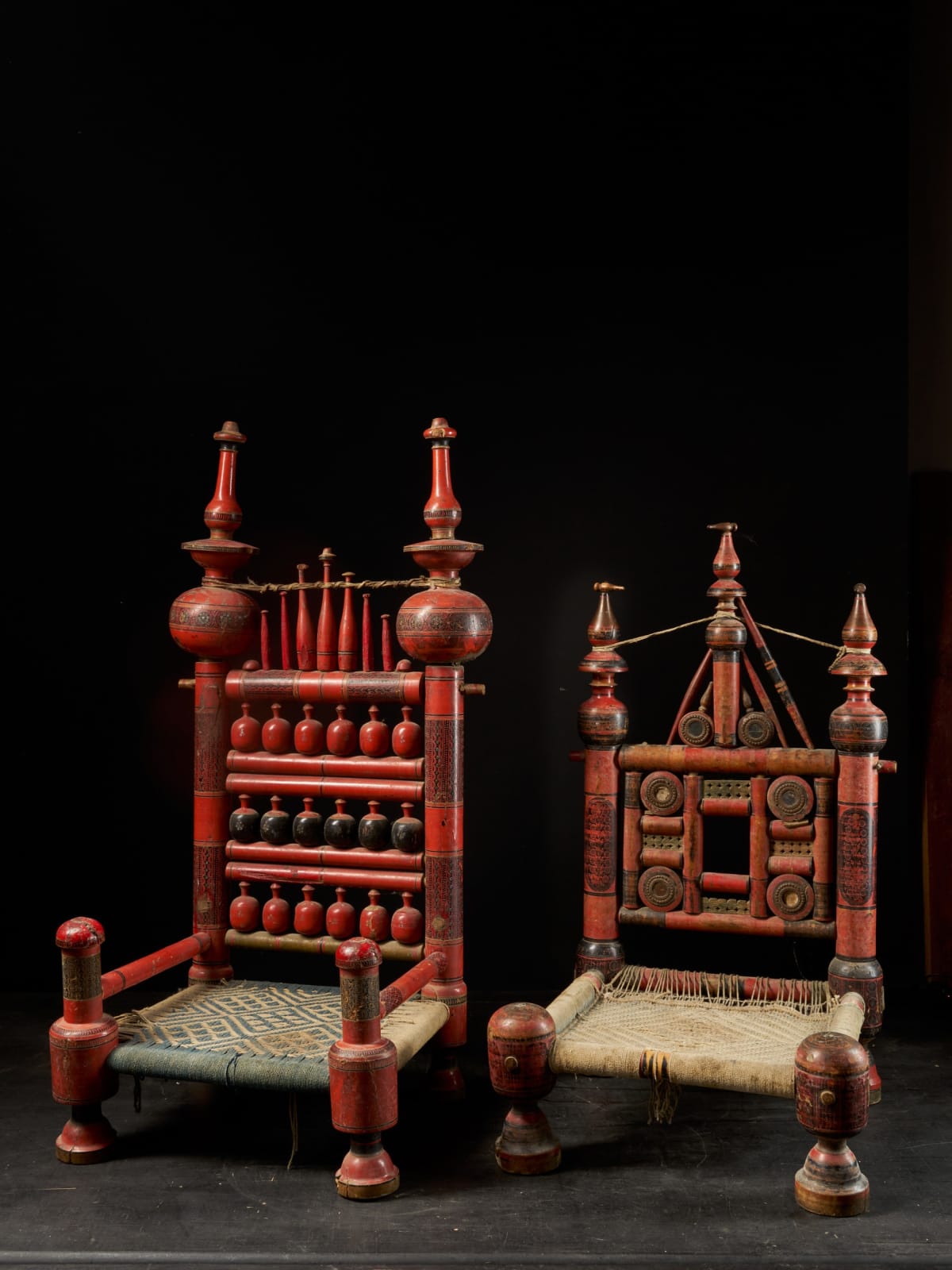A pair of old Punjabi polychromed hand crafted wooden tribal Wedding Chairs, 20th C