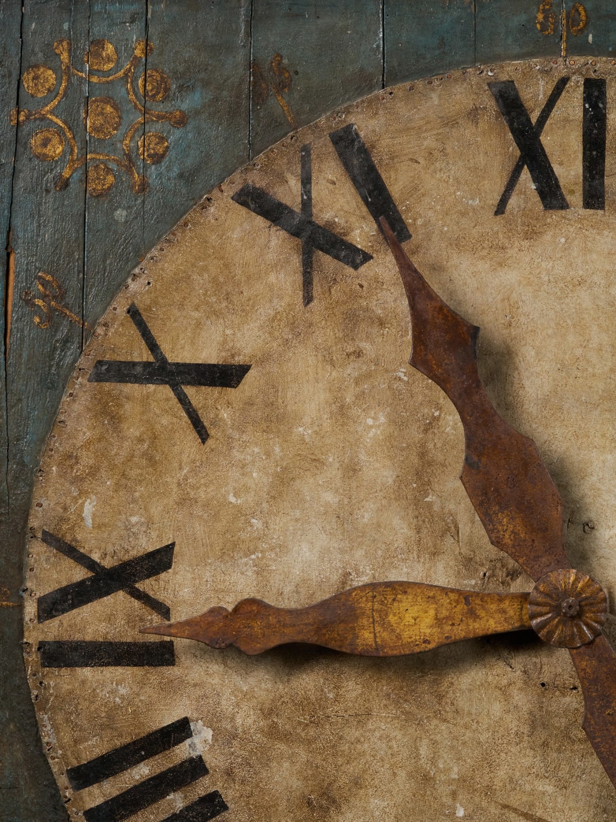 Early 19th C Clock on a Polychromed panel with leftover of the mechanism in the back.Gilded hands fixed on a tin sheet., first half 20th C
