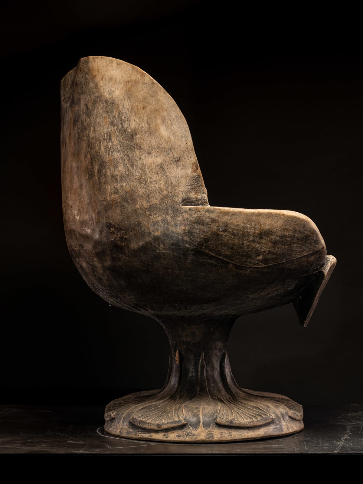 Set of 4 hardwood chairs hand-carved out of one solid block in the form of a stylized flower-form.,