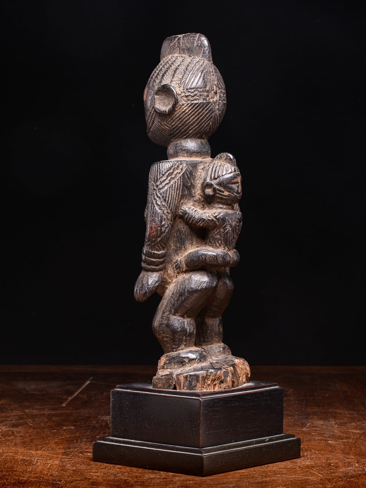 Igala scarified Maternity with infant on her back, Nigeria, 1st half 20th Century