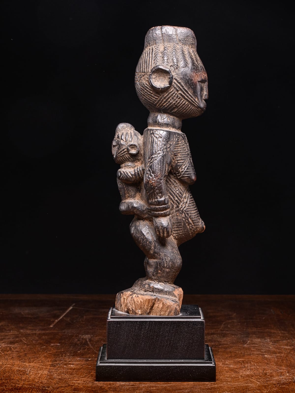 Igala scarified Maternity with infant on her back, Nigeria, 1st half 20th Century