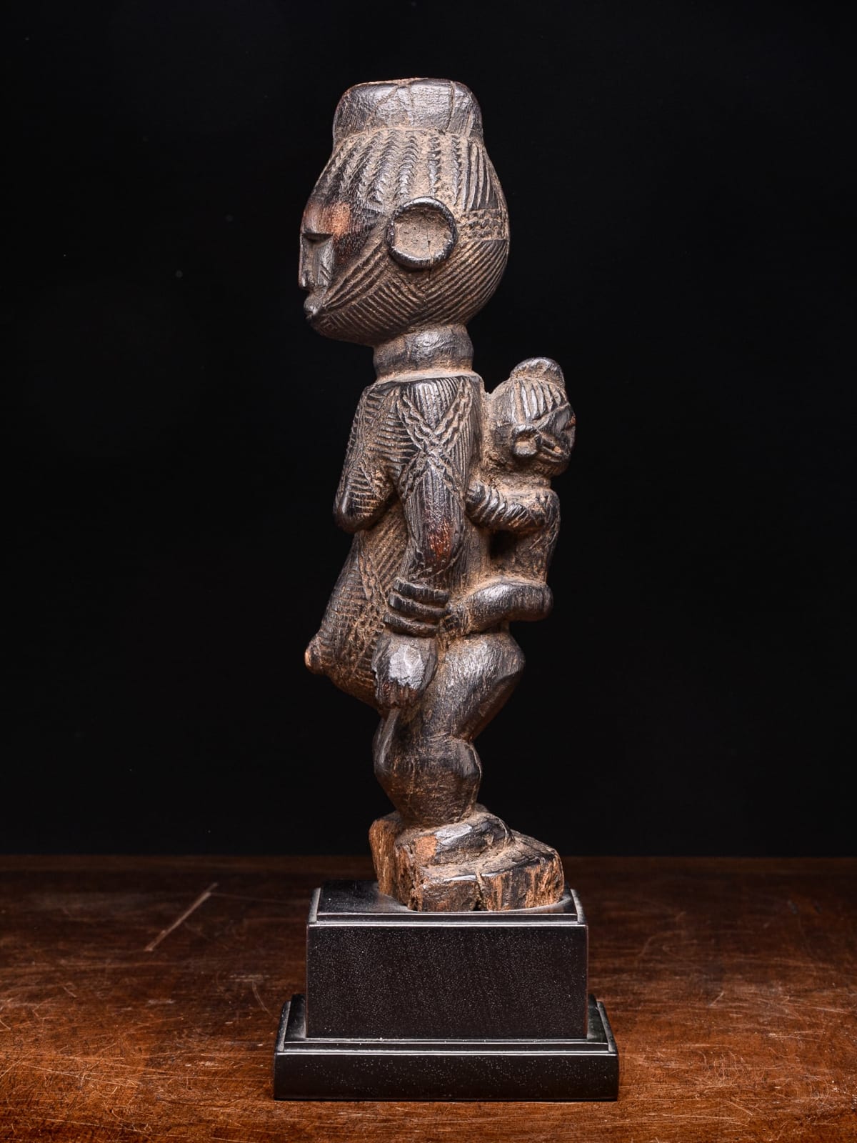 Igala scarified Maternity with infant on her back, Nigeria, 1st half 20th Century