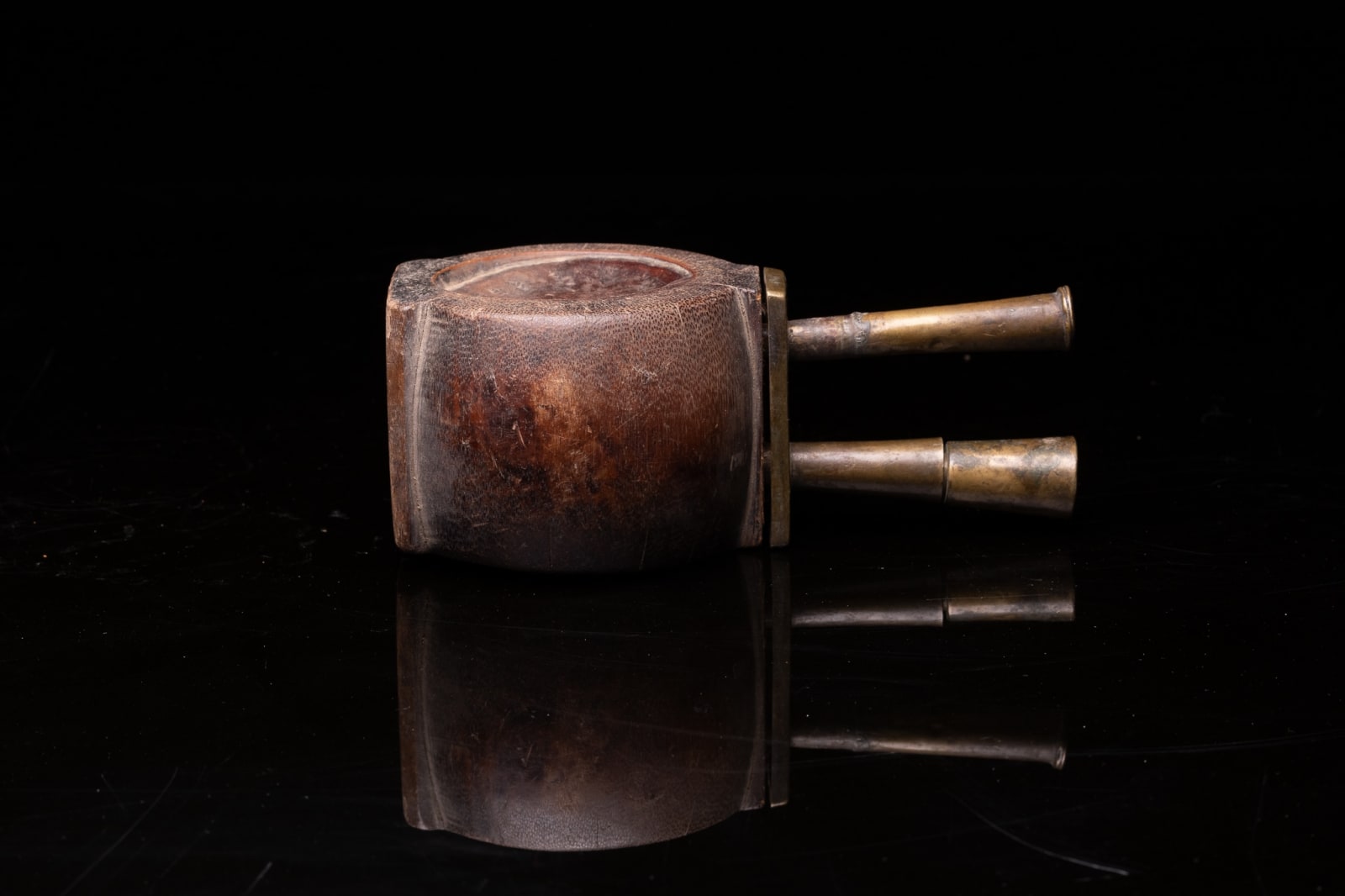 Old Bamboo Opium Pipe, with visible Knot of the Bamboo. The Mouthpiece and Furnace are in Bronze. The Piece comes from South China., 19th Century