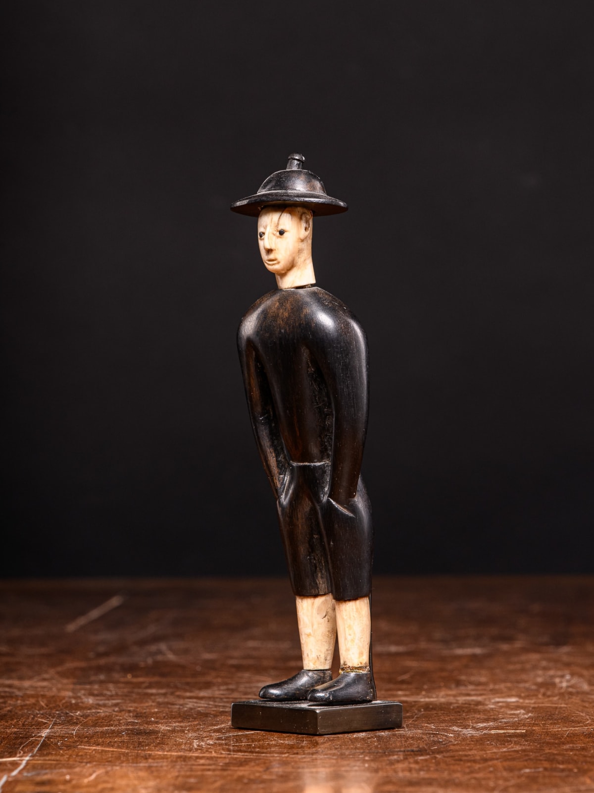 Kongo Ebony wood statue depicting Chinese worker waring Ivory hat,DRC., first half 20th C