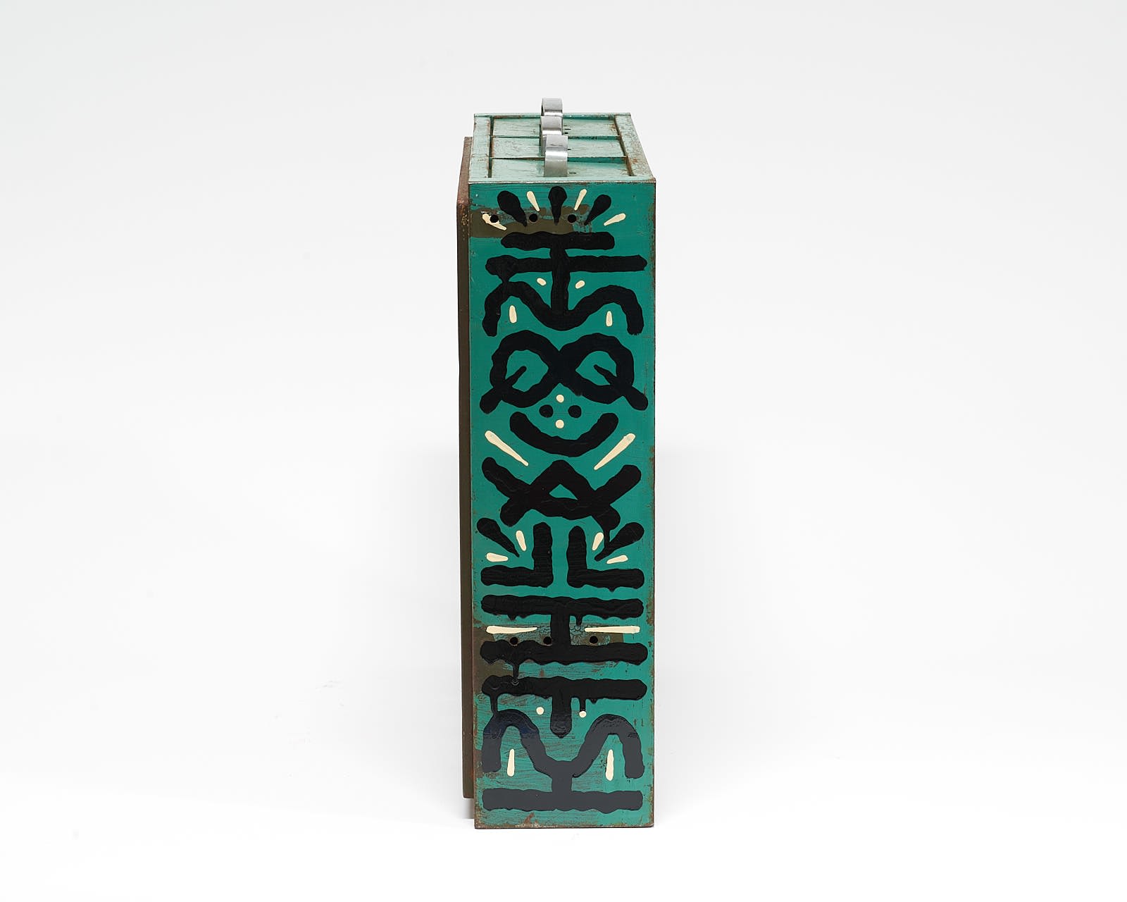 vintage filing cabinet adorned with designs of a geometric figured