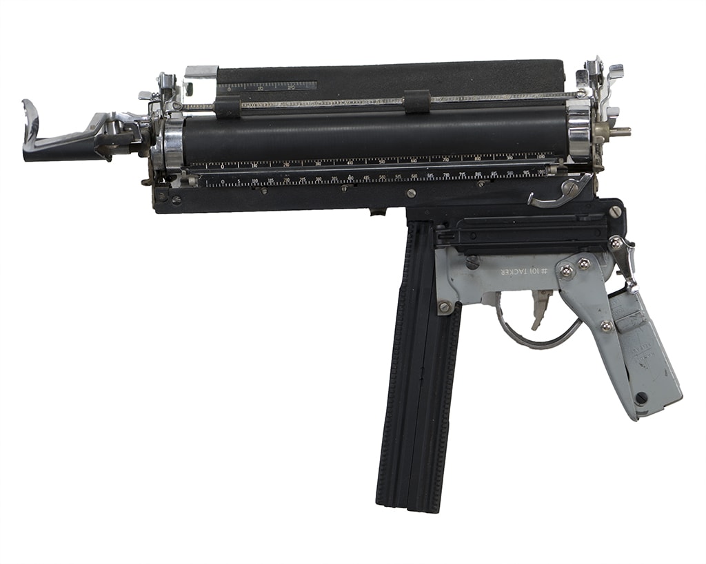 Sculpture of a sub machine gun made of typewriter parts by Ravi Zupa