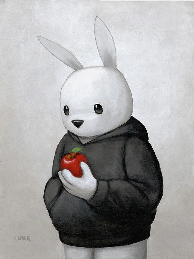 white rabbit in a black hoodie holding a red apple against white background