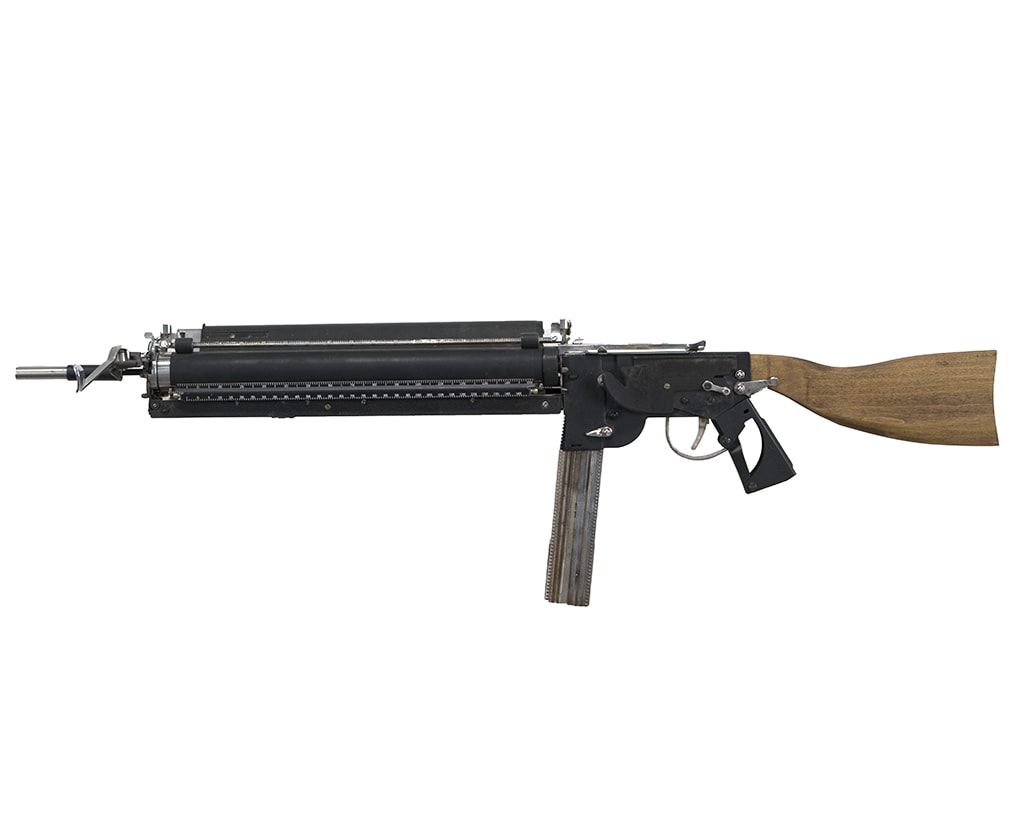 Sculpture of an assault rifle made of type writer parts by Ravi Zupa