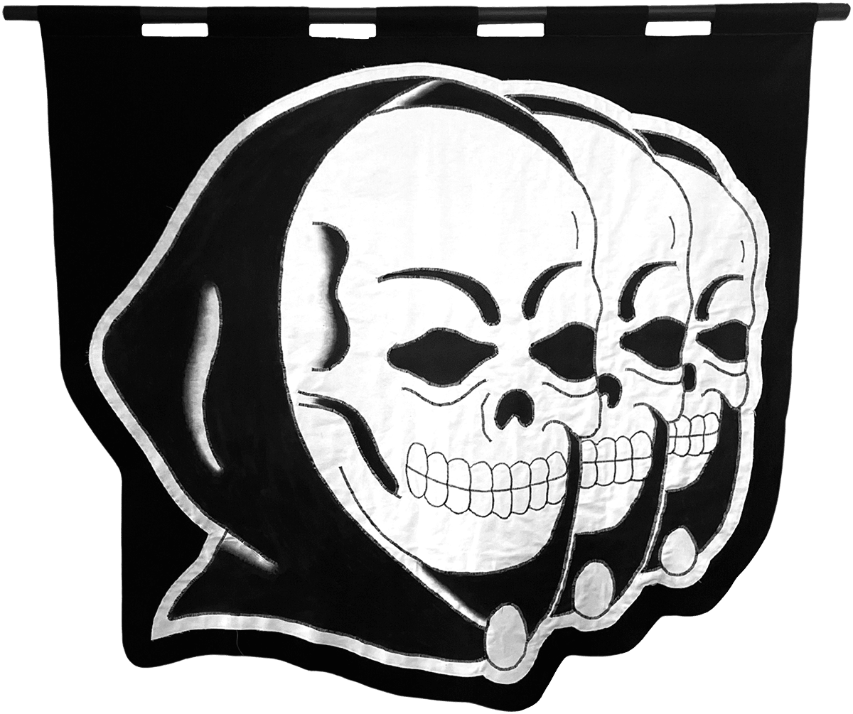 embroidered black and white banner showing three hooded skulls in a row