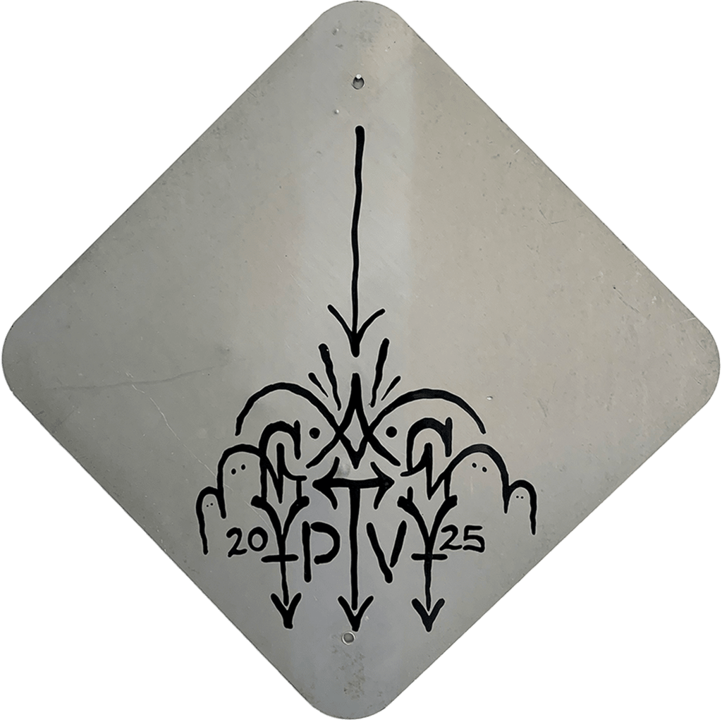 Back of road sign with GATs's signature.