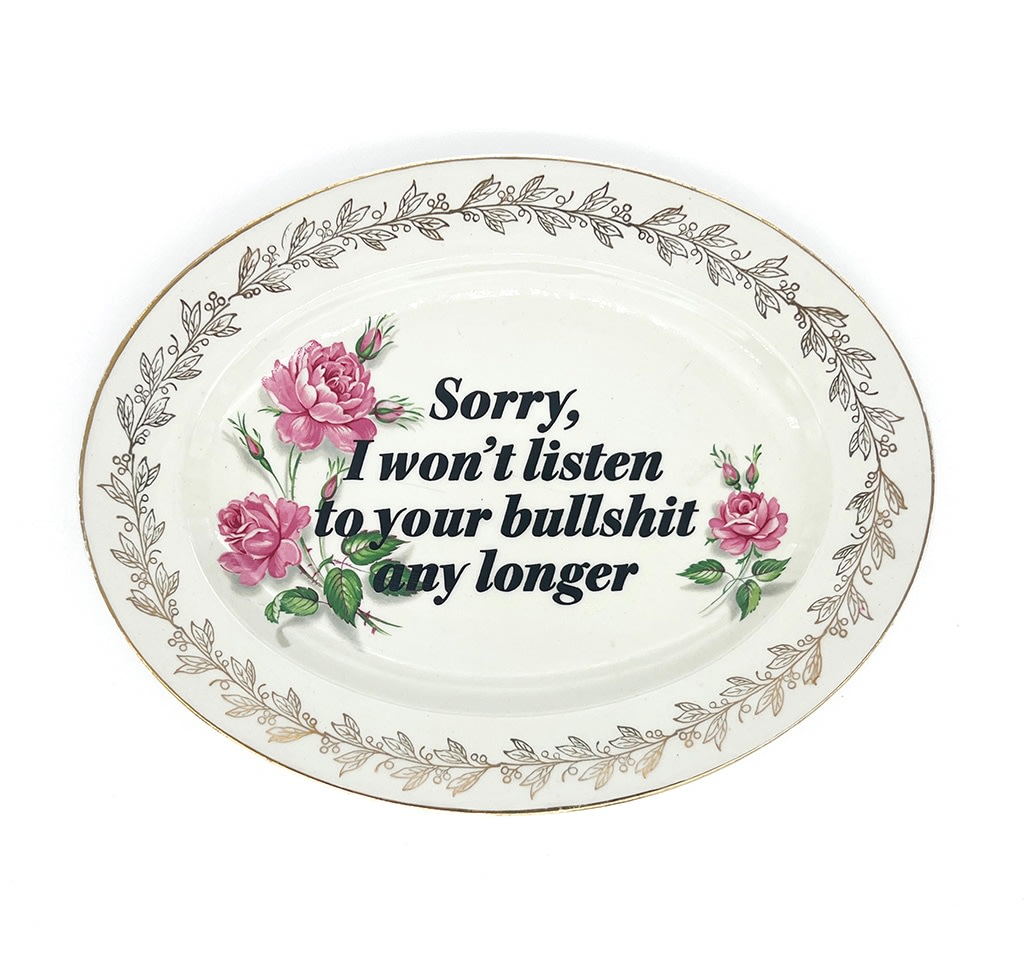 ceramic plates with words painted on them