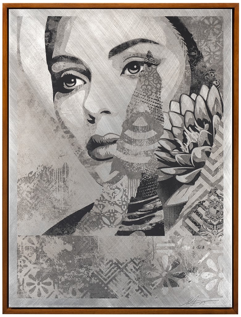 ximage of a womans face collaged with various textures and patterns including a lotus flower