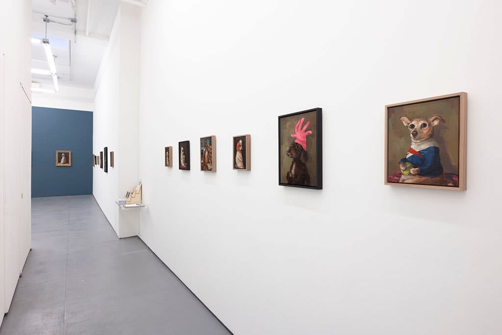 Install photo of Alison Friend's paintings hanging on a white wall