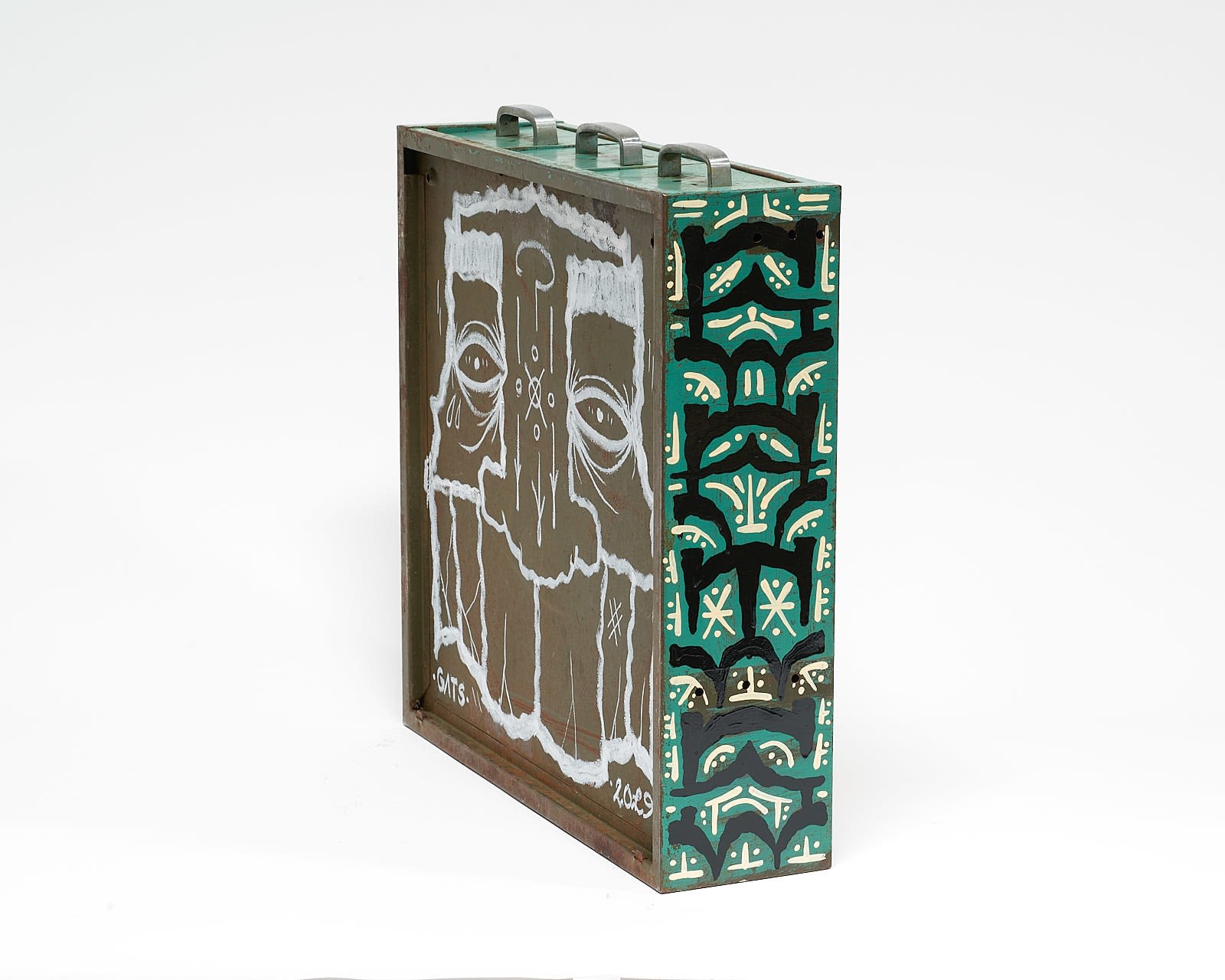 vintage filing cabinet adorned with designs of a geometric figured