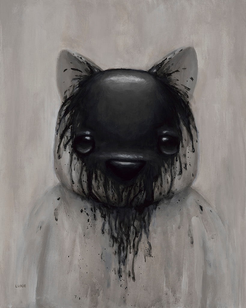a white bear splashed with black paint over its face