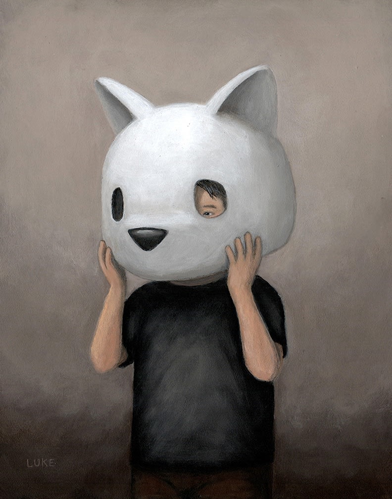 a human holding a bear head helmet over his own head