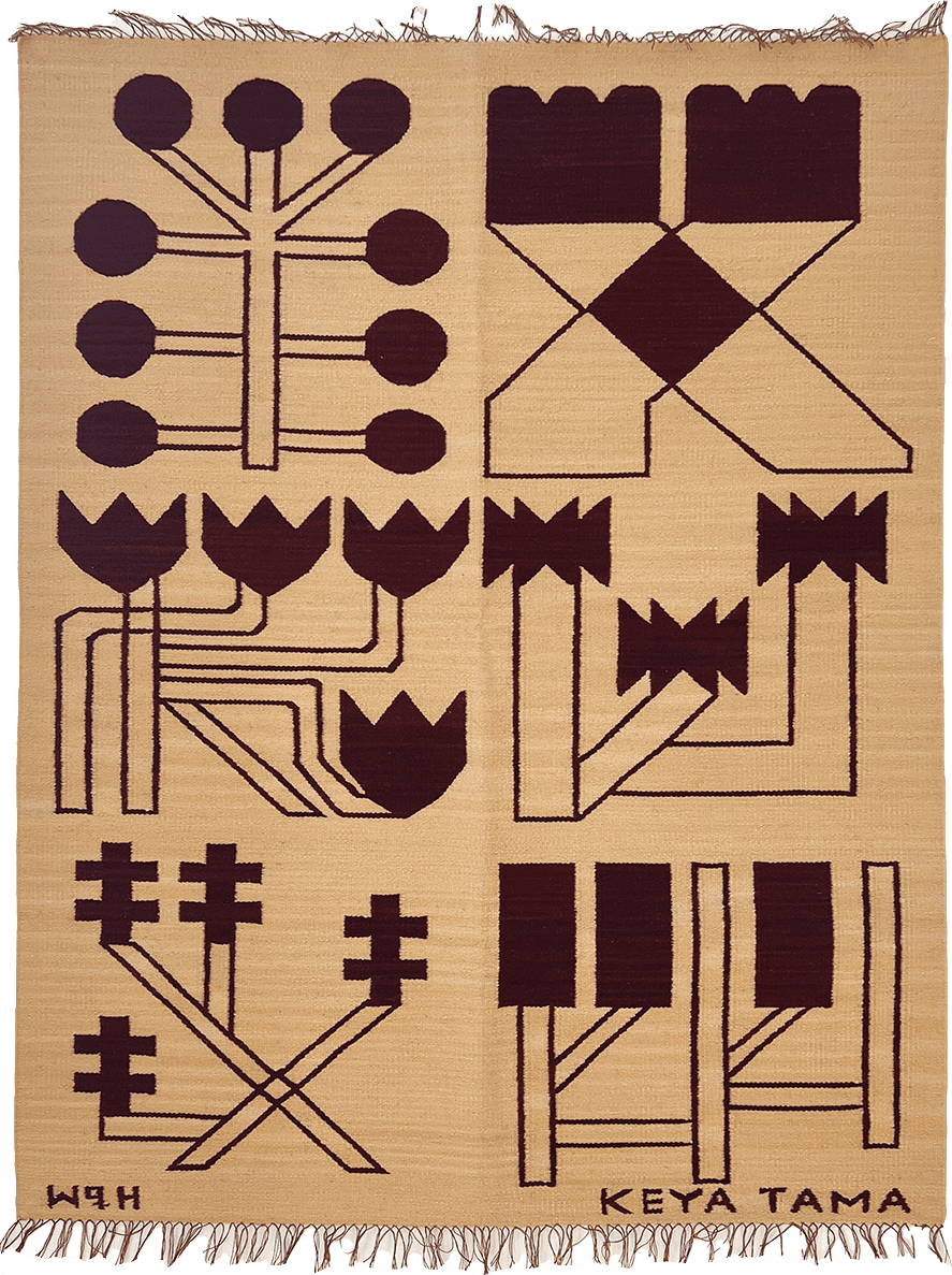 tan knit blanket displaying abstract symbols by the art Keya Tama
