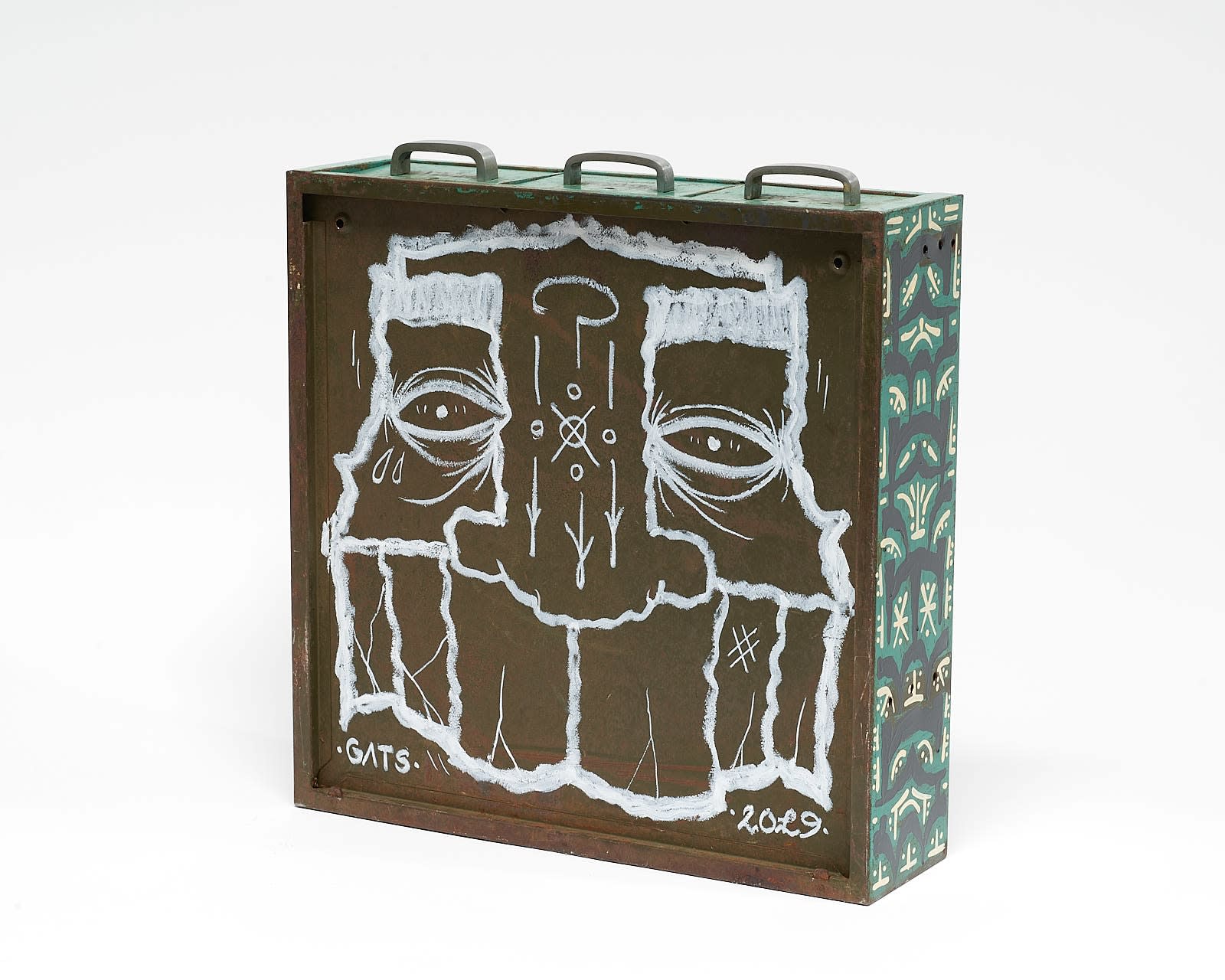 vintage filing cabinet adorned with designs of a geometric figured