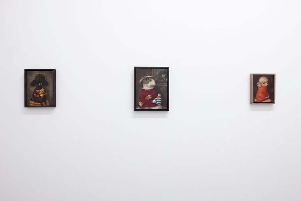 Install photo of Alison Friend's paintings hanging on a white wall