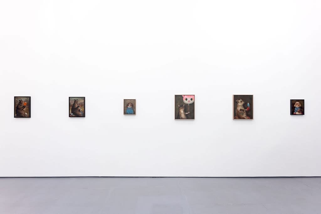 Install photo of Alison Friend's paintings hanging on a white wall