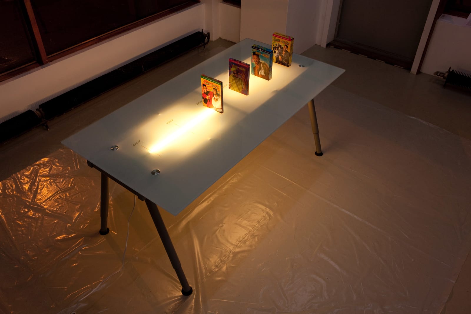 Simon Denny, DVD Box Projection Table, 2009