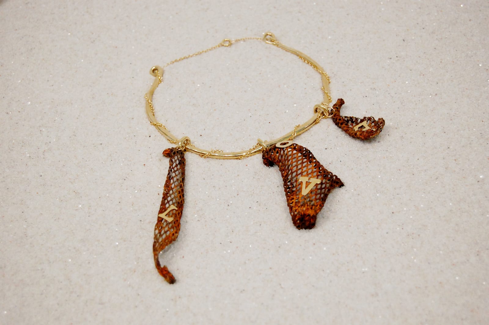 Jewelry, necklace with letters L, V, E on mesh elements