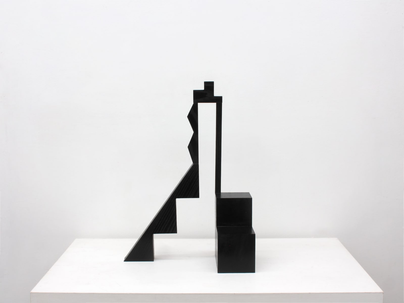 Carved dark wood two legged sculpture, abstract