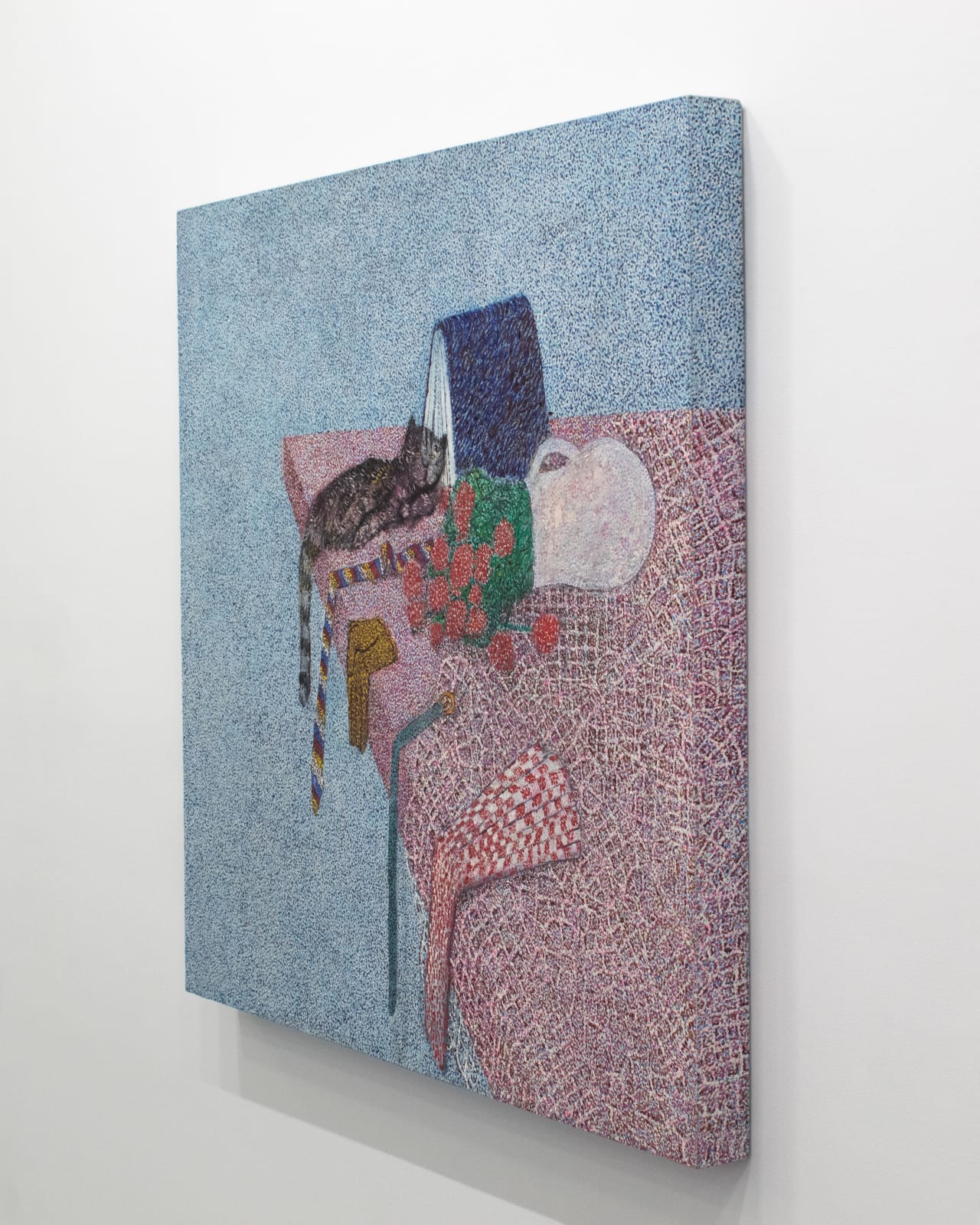 Right angle view of painting of cat flowers and ties with tail and ties hanging off edge of table