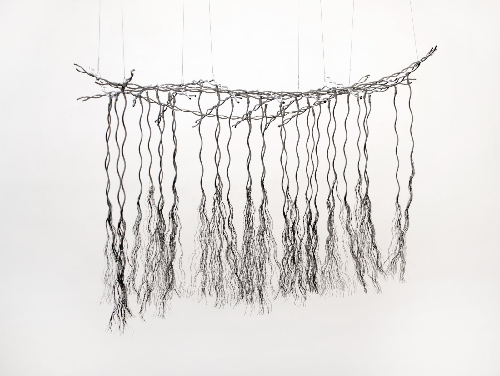 Bundles of wire rope hanging from wire net