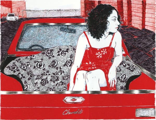 Woman in red dress sits on floral blanket in bed of red truck