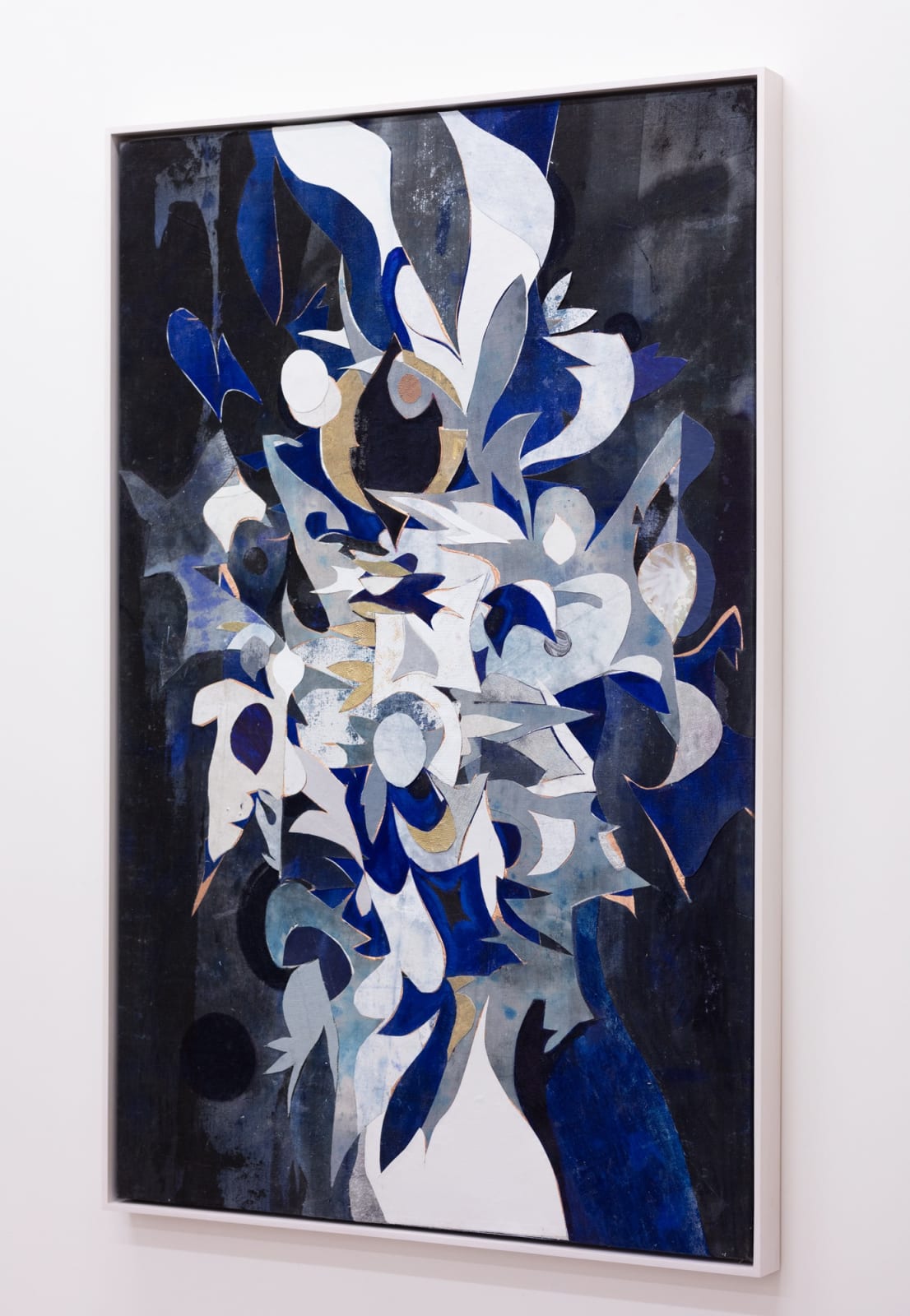 Side view of abstract collage created from cut-up paintings and studio detritus