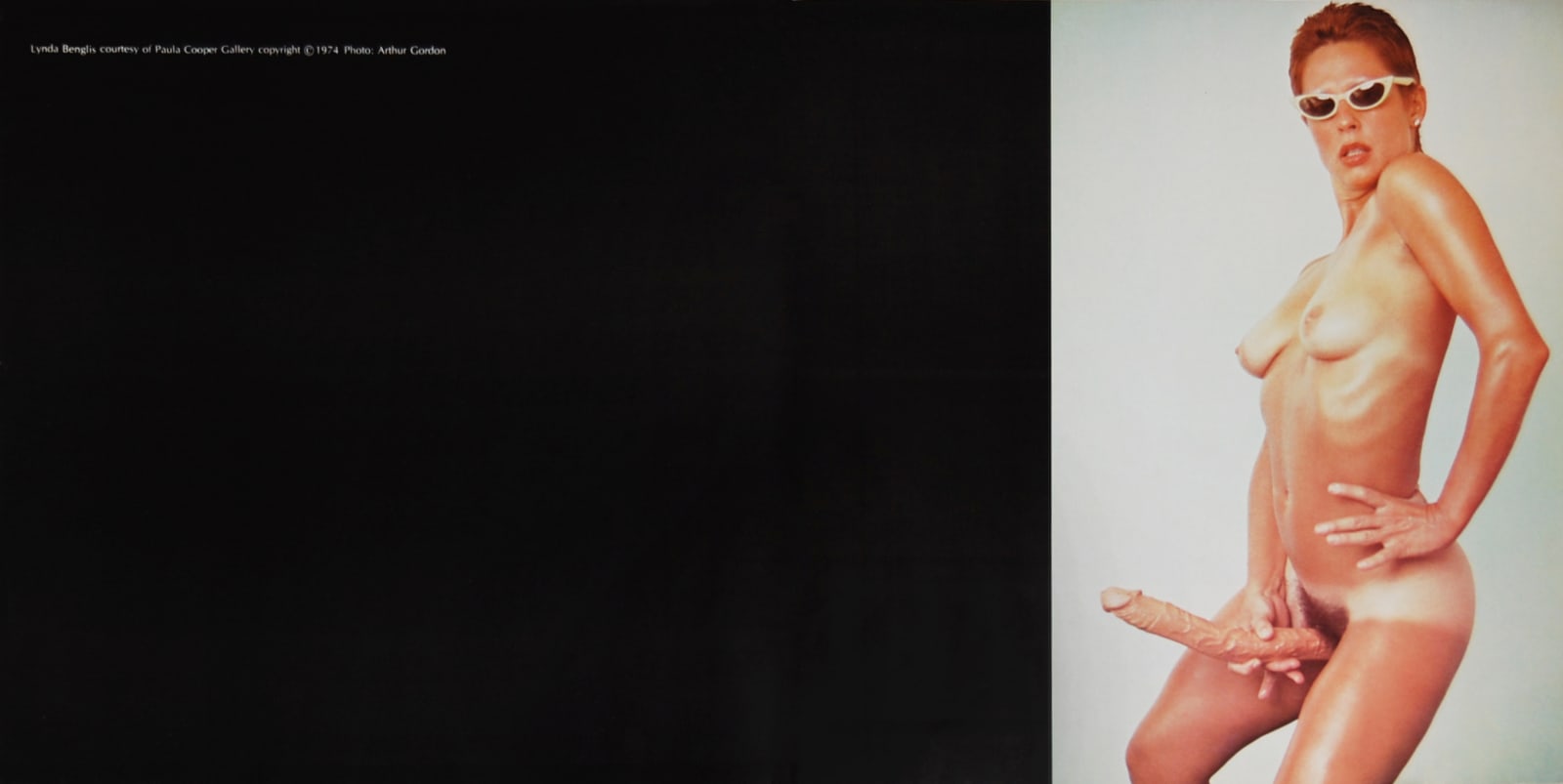 Magazine advertisement showing artist posed nude with dildo