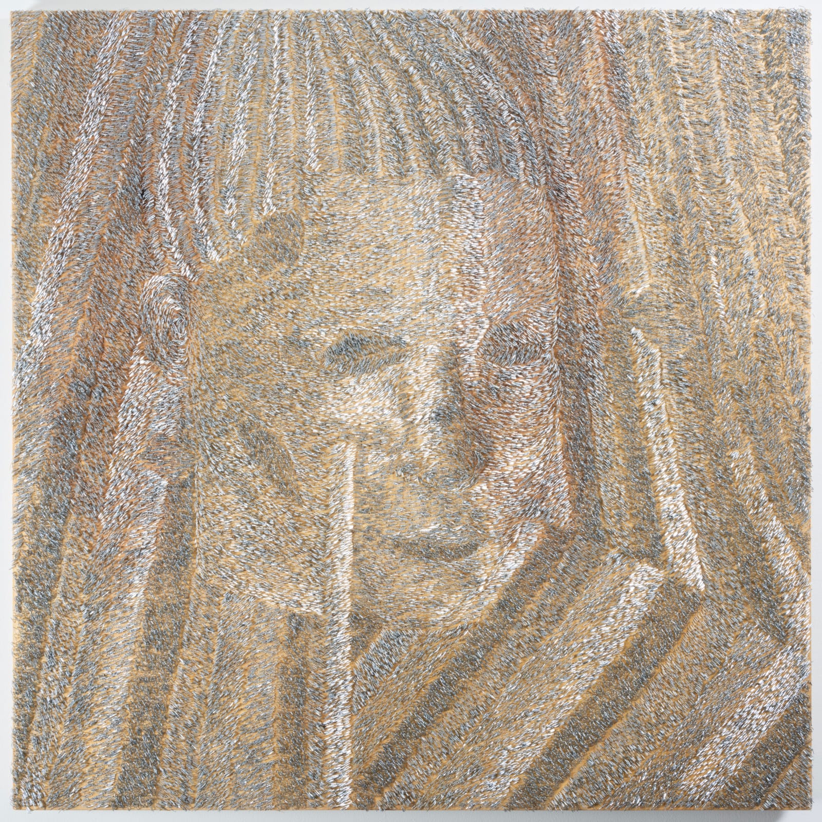 Staples on wood assembled to resemble a face