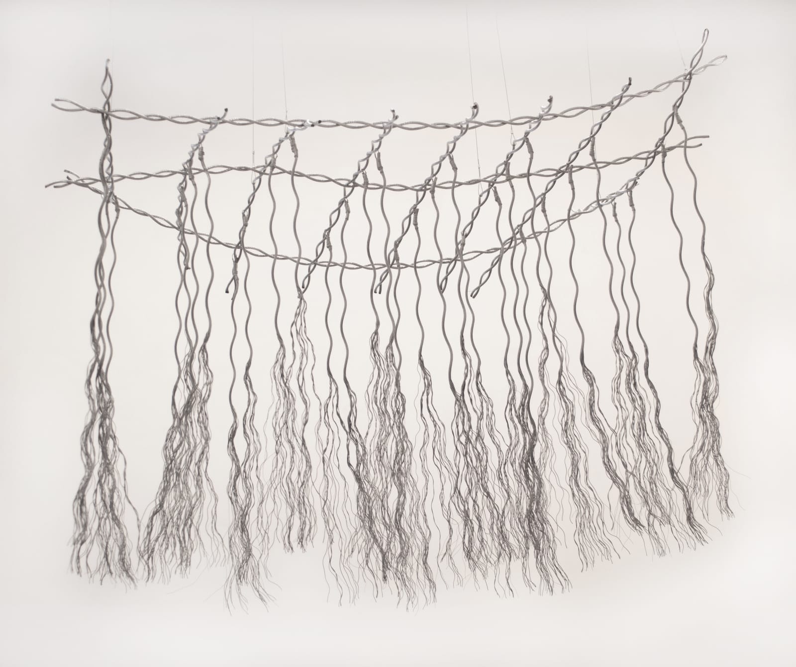 Bundles of wire rope hanging from wire net