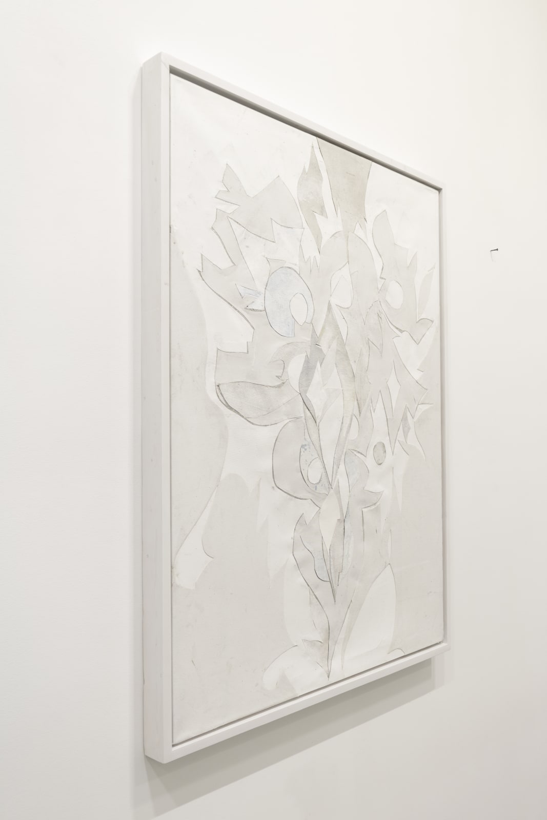 Installation view of abstract collage created from cut-up paintings and studio detritus