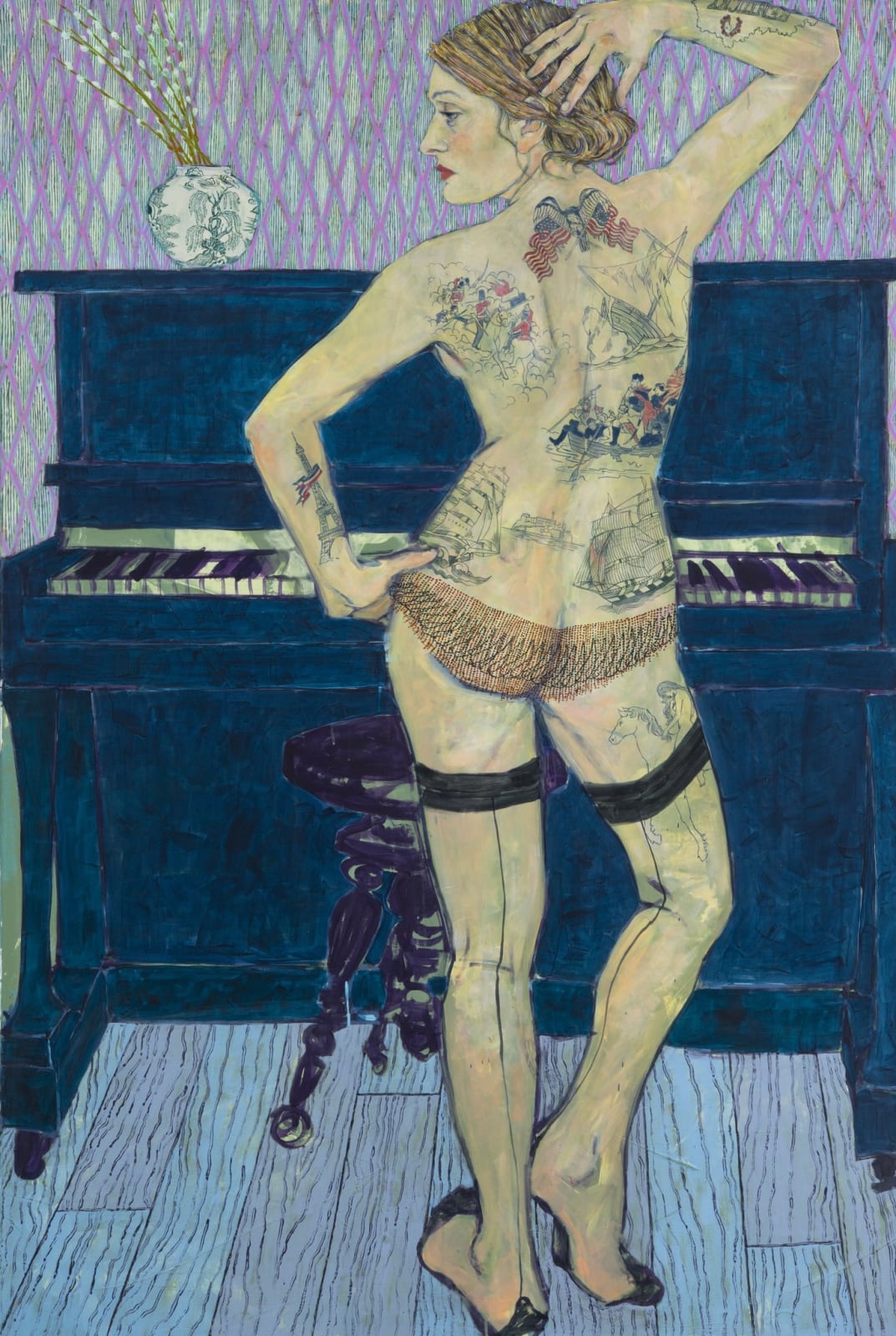 A woman in her underwear and tights poses in front of a piano showing off her back tattoos