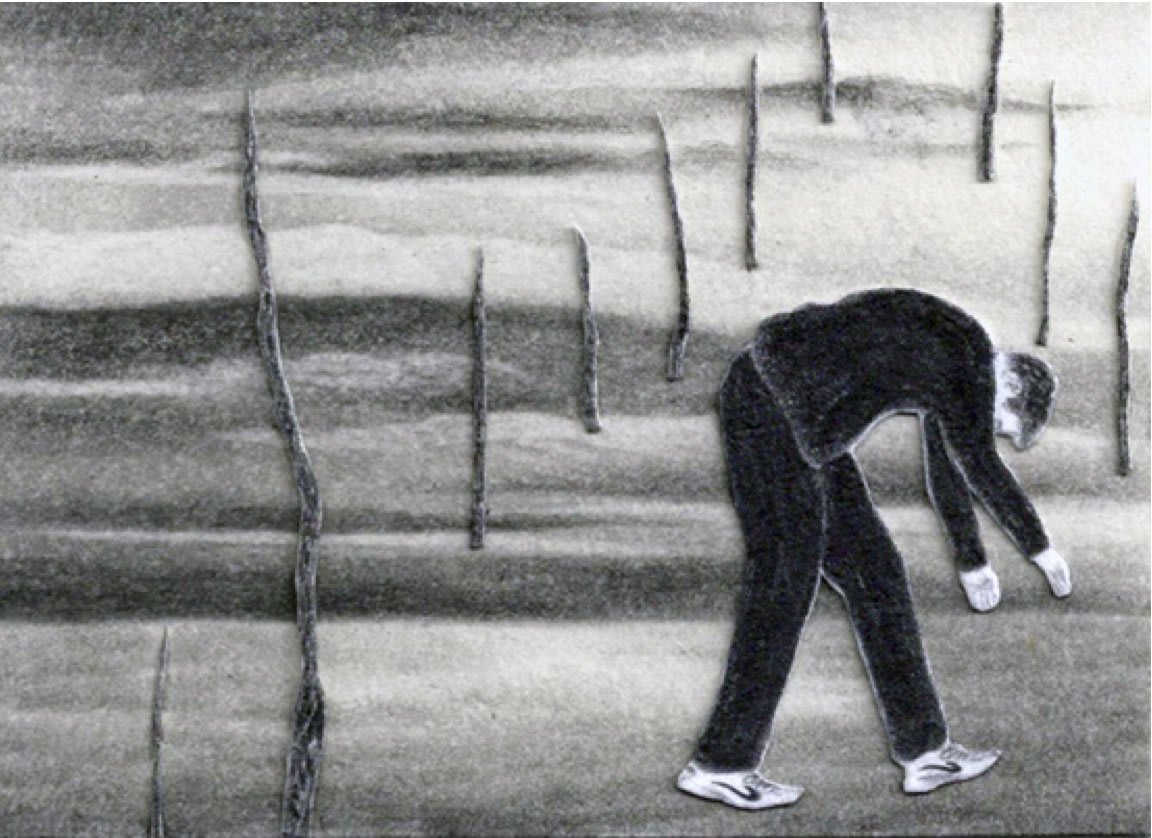 A man hunches over in a landscape