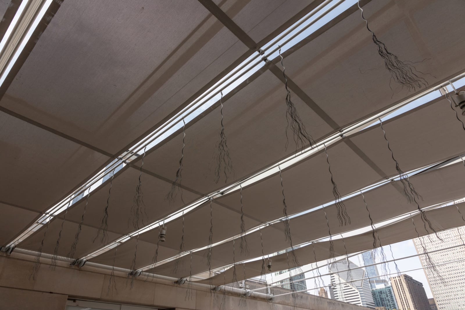 Bundles of wire rope hanging from wire net