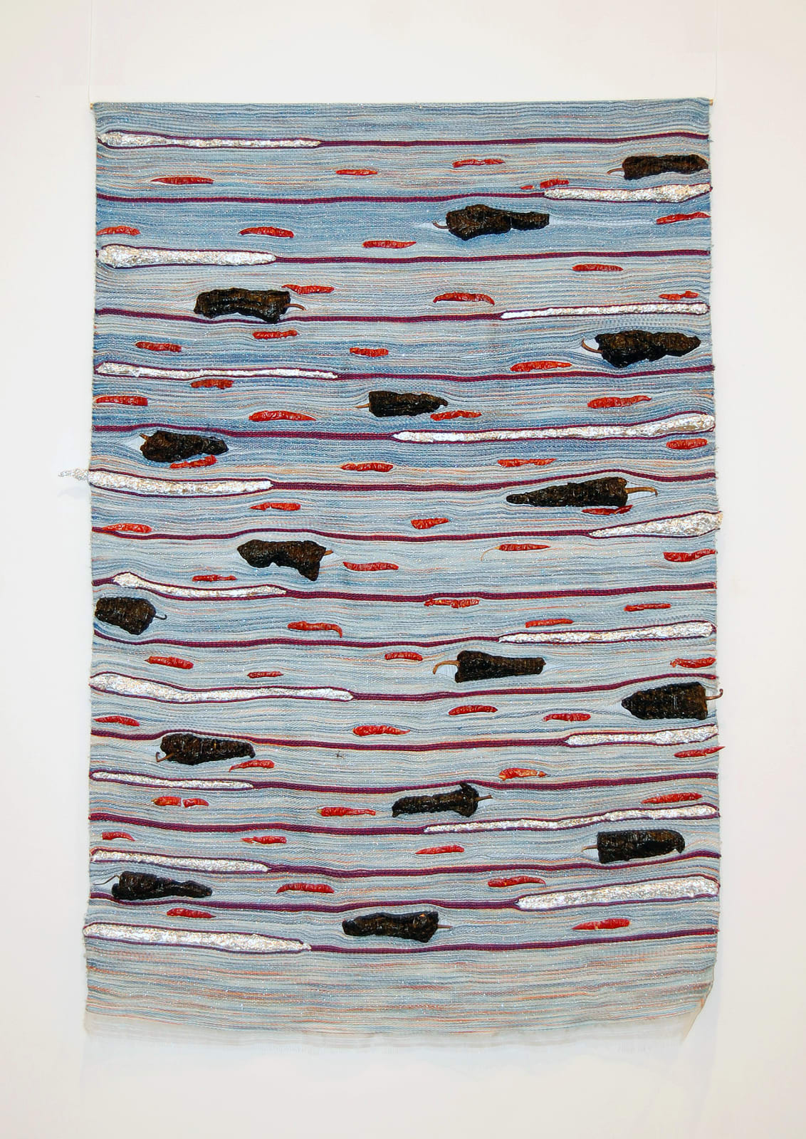 Woven wall hanging with peppers