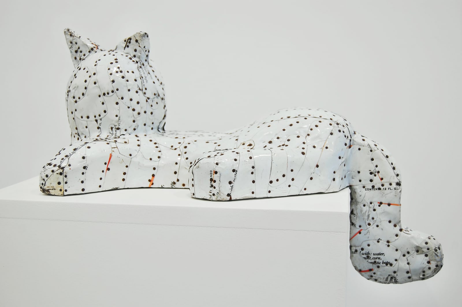 sculpture of a white tin cat