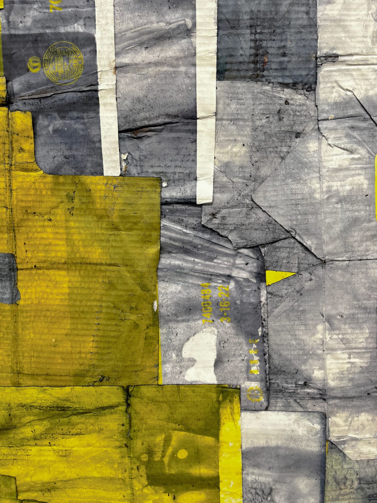 Close-up of abstract painting that uses a dark tone over fabric with a red and white checkerboard pattern