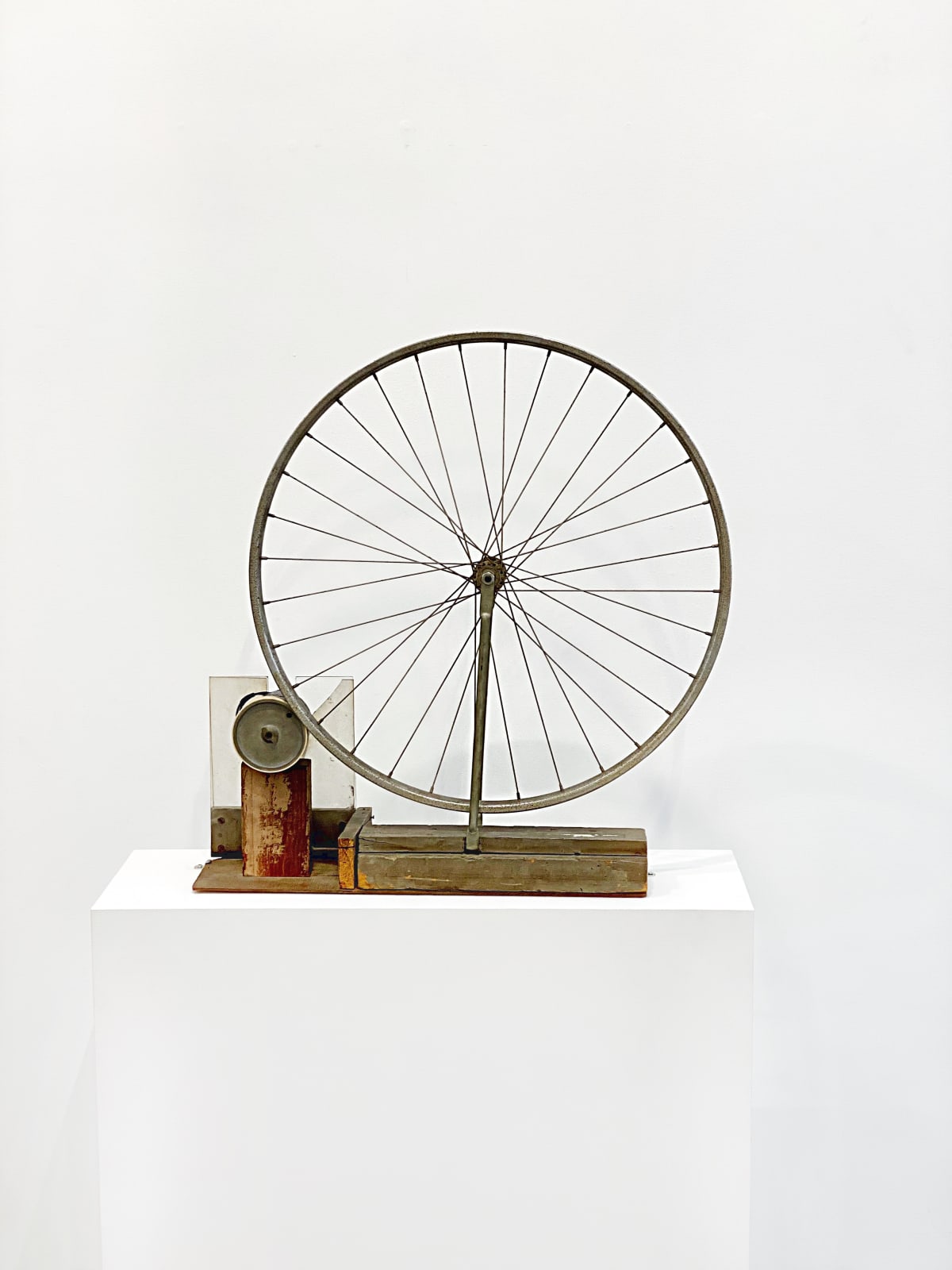 A bicycle wheel attached to a motor such that it may spin on its axle