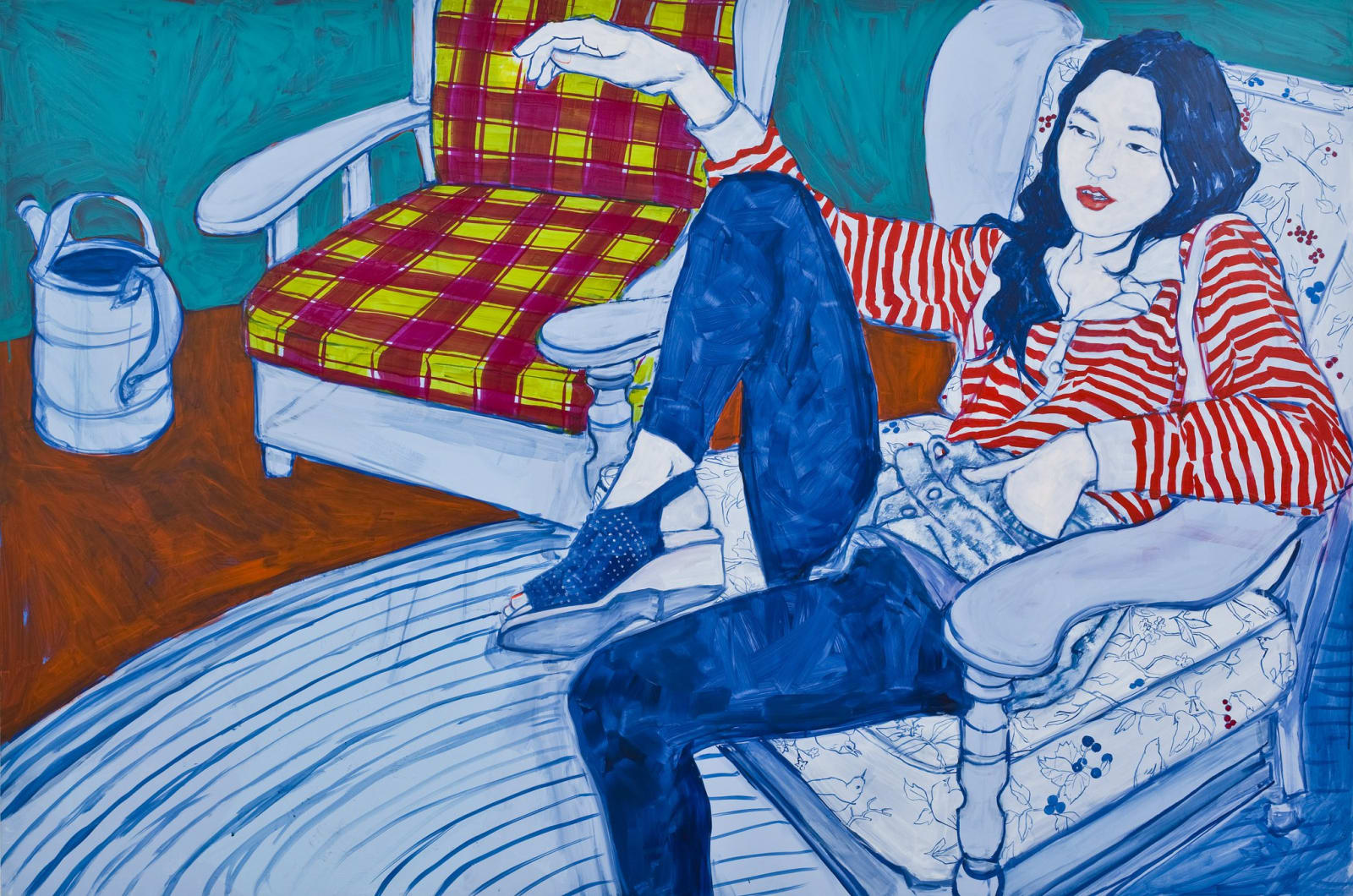 Portrait of a woman in a striped shirt sitting on a chair