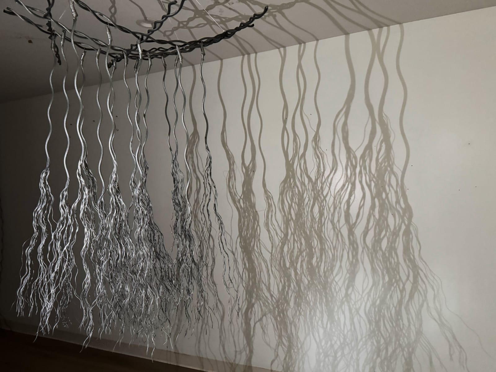 Bundles of wire rope hanging from wire net