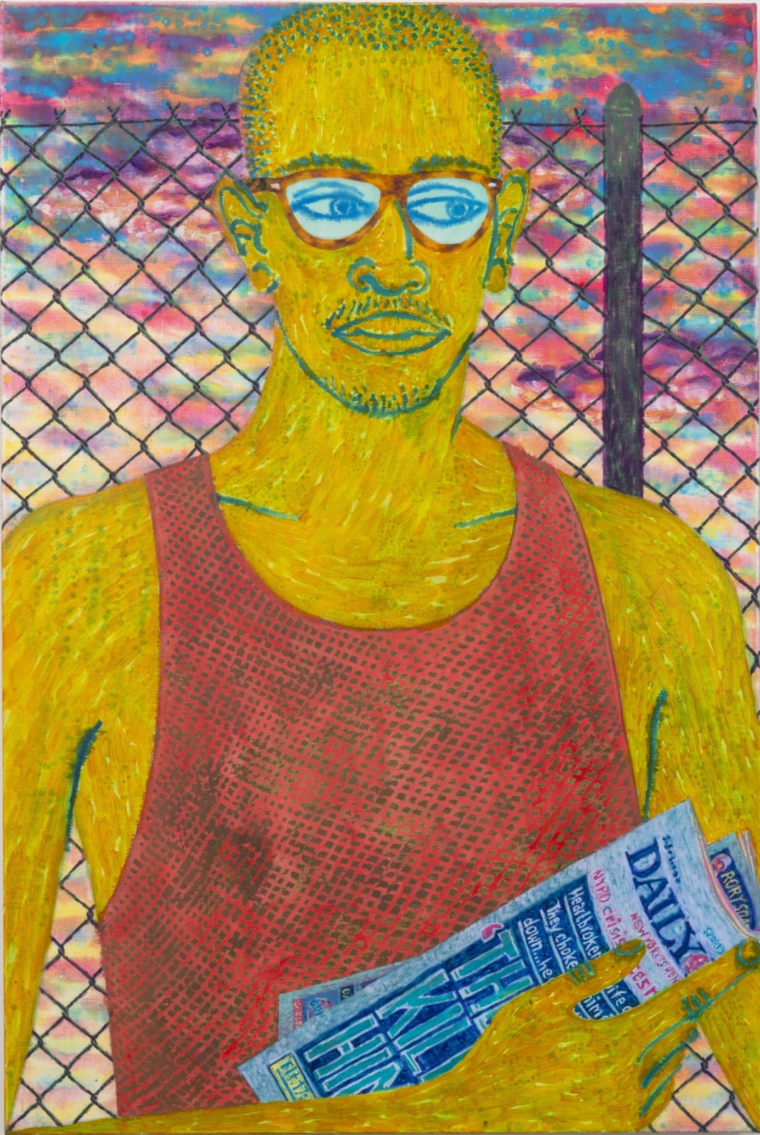 Man wearing glasses and a tank top holds a newspaper, stands in front of chain link fence