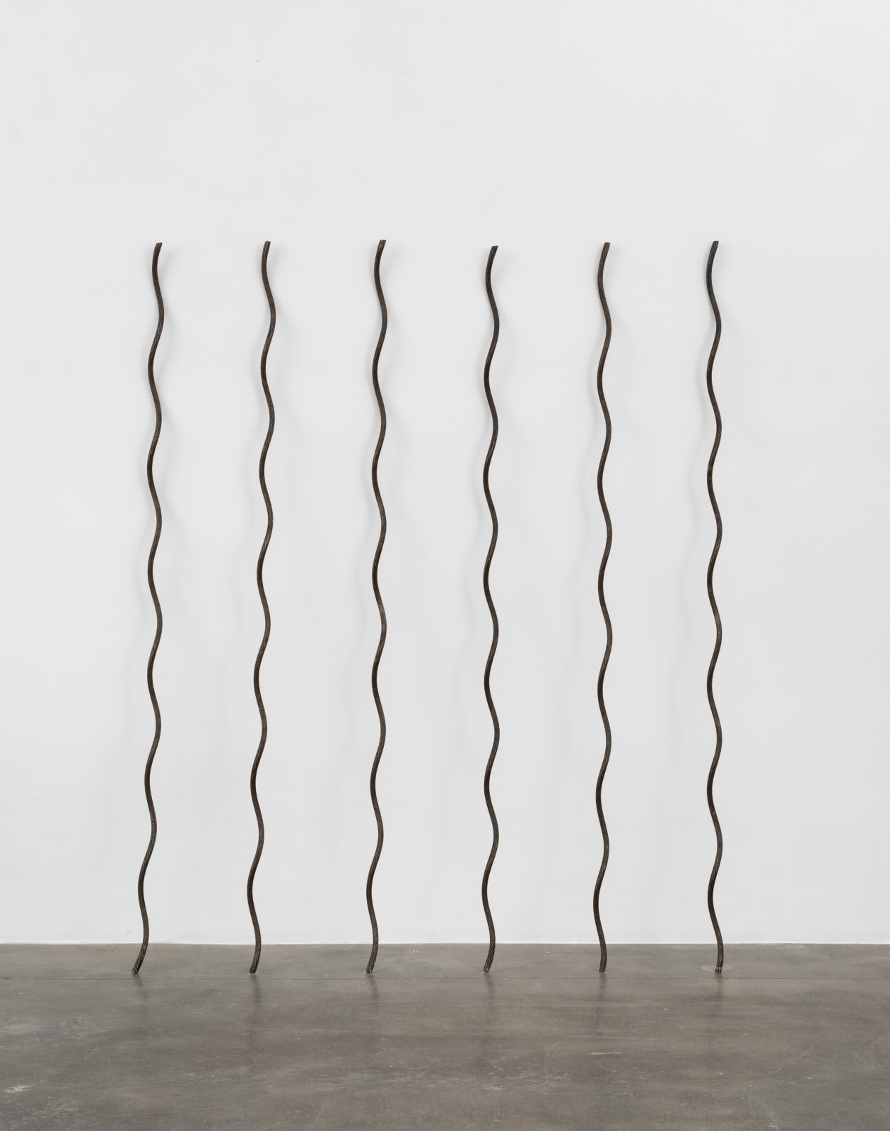 6 galvanized rods in a line